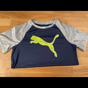 Puma Dri fit material T-shirt. Size 10/12. Blue with gray sleeves and neon puma.